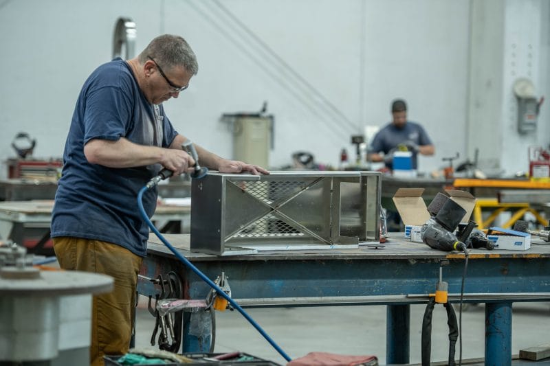 Blending and finishing stainless welds for uniform surface quality.